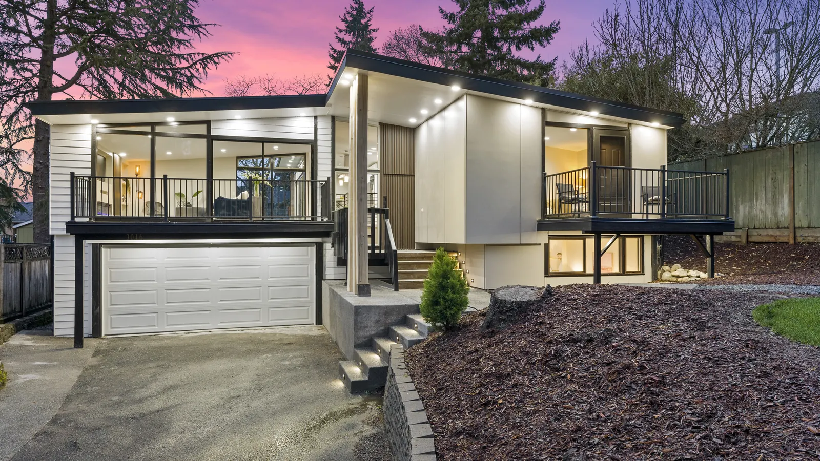 Twilight exterior of a modern Puget Sound home shot by Vourly